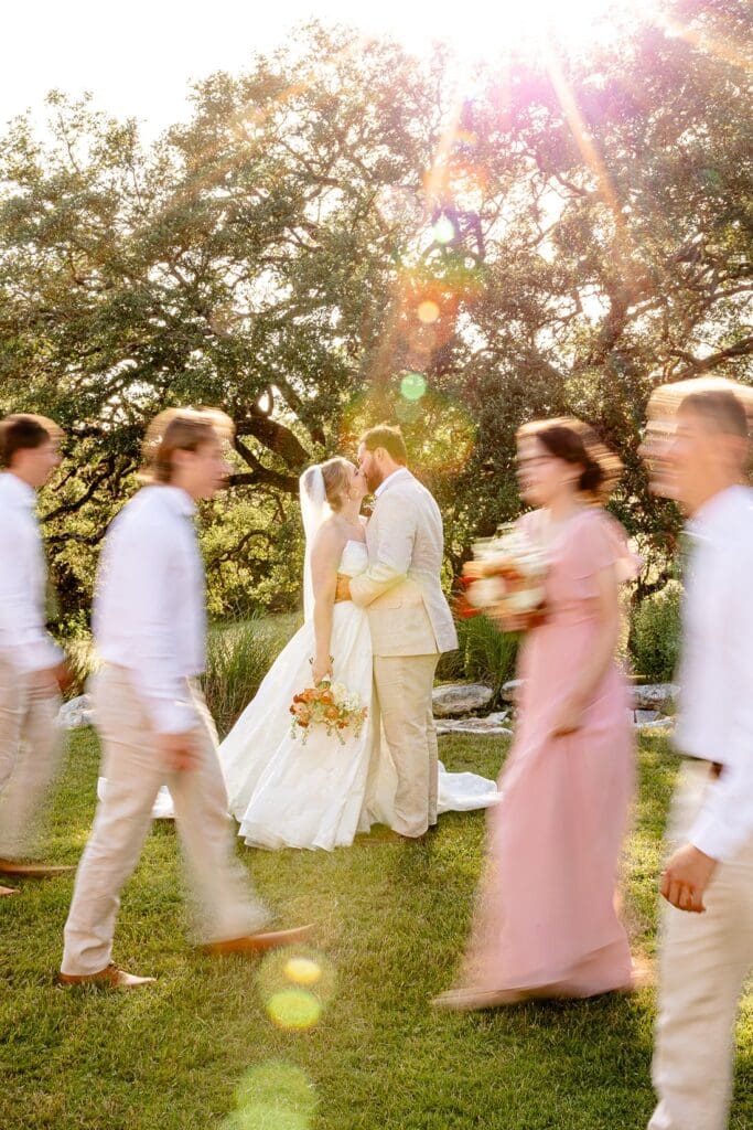 Full wedding party photo outside The Milestone wedding venue in Boerne