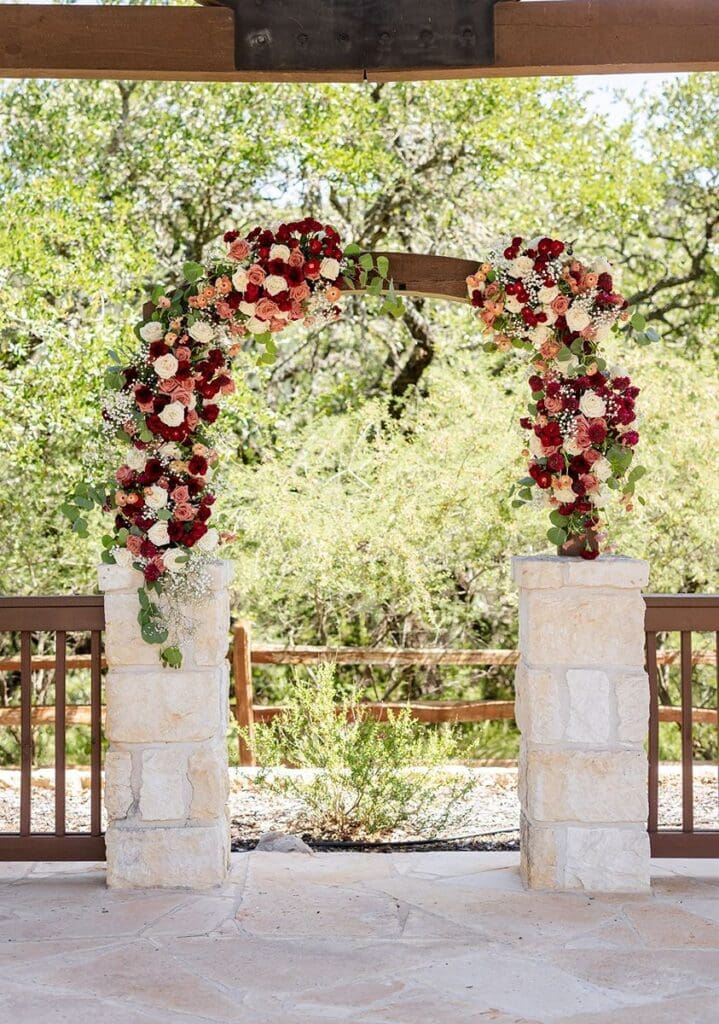 Wedding ceremony arch with florals at The Milestone in Boerne Texas