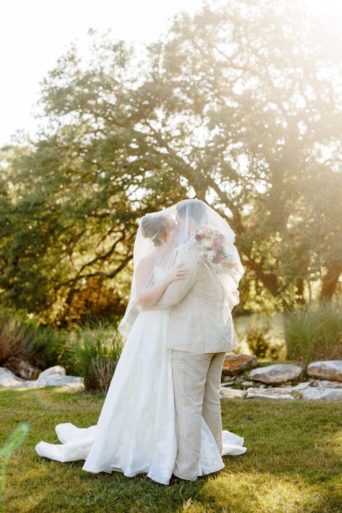 Newly married couple celebrating outside The Milestone wedding venue in Boerne