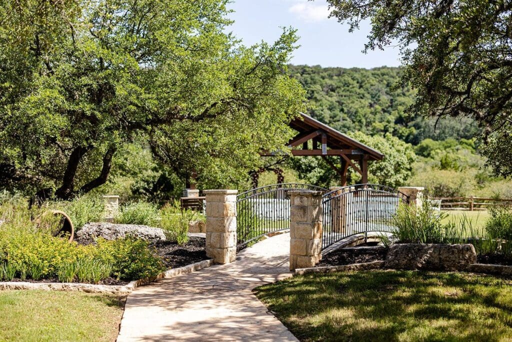 Bridge nearby outdoor ceremony setup at The Milestone wedding venue in Boerne Texas