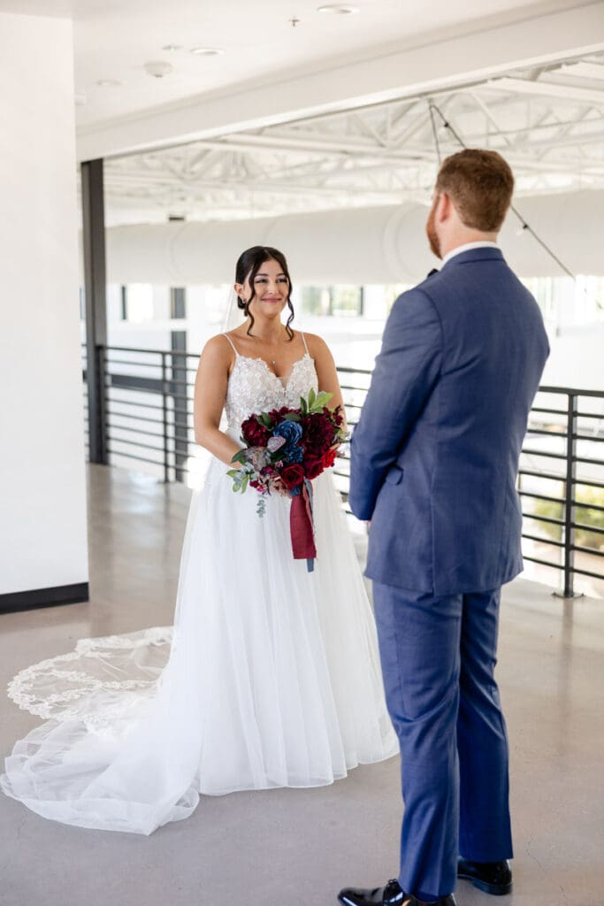 Bride and groom first look moment inside The Skyline San Antonio wedding venue before their rooftop ceremony.