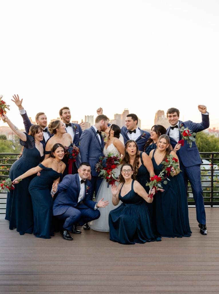 Bridal party celebrating together on the rooftop terrace at The Skyline San Antonio wedding venue.