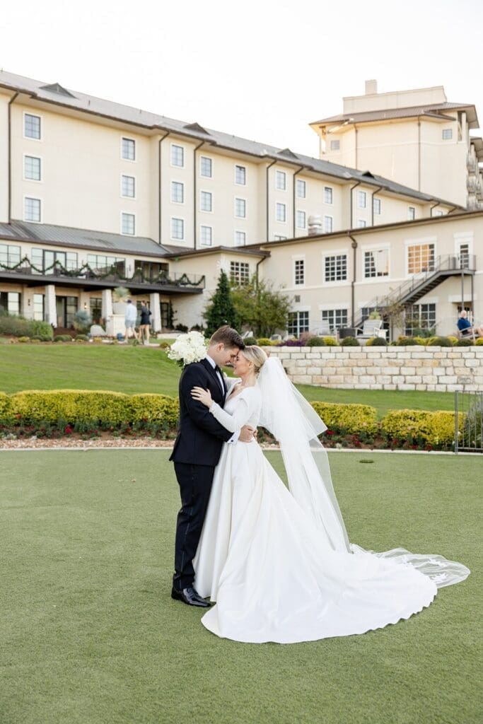 married couples portraits outside of hotel