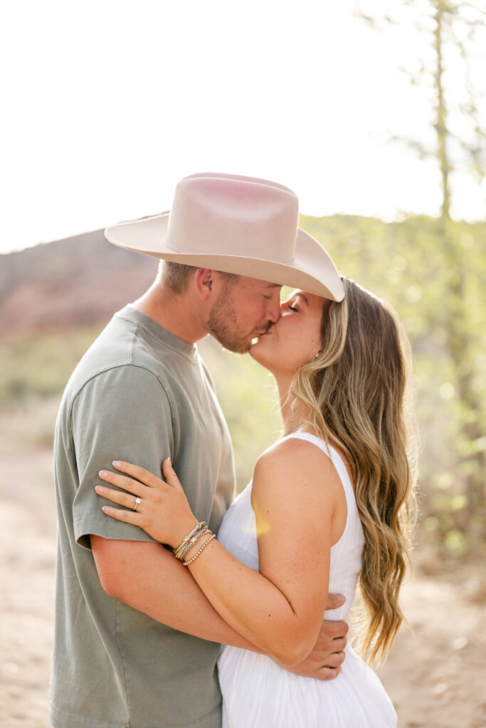 couple kiss during engagement session