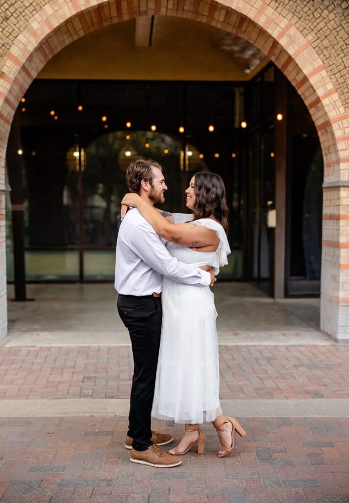 couple wrapped up with each other at The Pearl in San Antonio