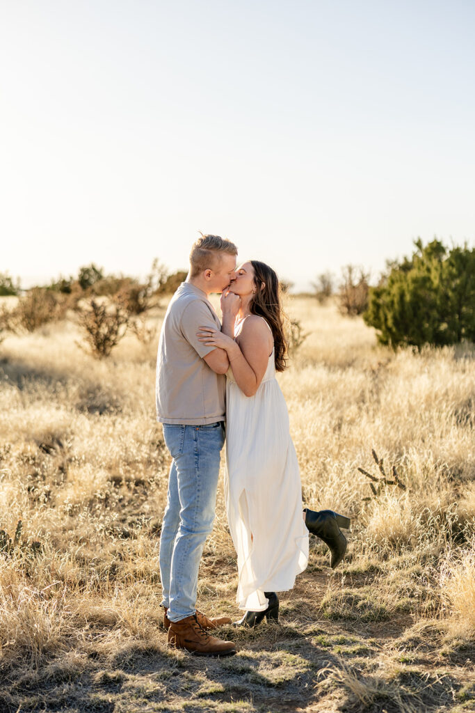Couple kiss at sunset